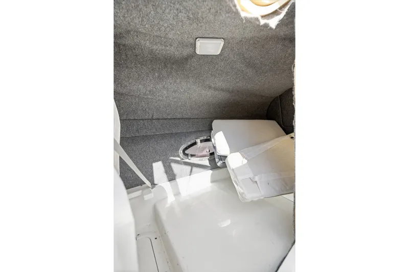 Slide: The Image of Interior cabin of 2016 Formula 330 Crossover Bowrider, featuring compact storage space. - 53