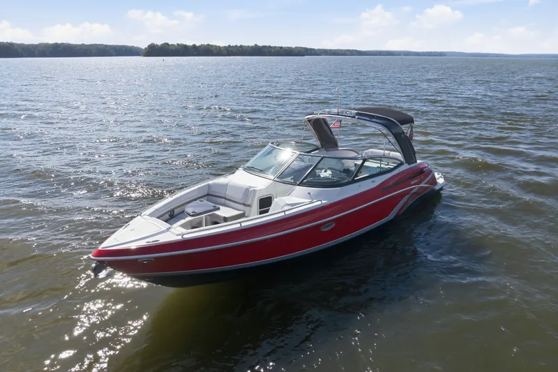 Slide: The Image of 2016 Formula 330 Crossover Bowrider on a sunny lake, showcasing sleek design and vibrant colors. - 2