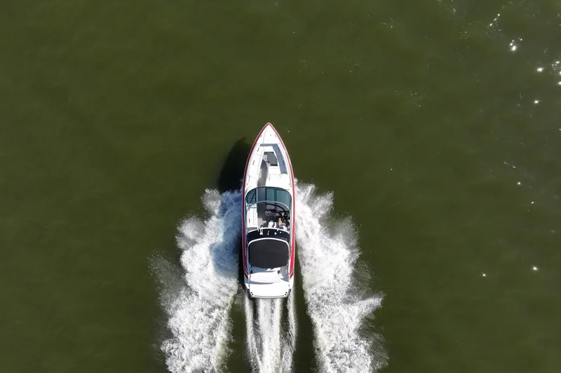 Slide: The Image of Aerial view of 2016 Formula 330 Crossover Bowrider speeding on water. - 18