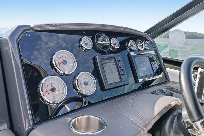 Slide: The Image of Dashboard of 2016 Formula 330 Crossover Bowrider with gauges and navigation system. - 33