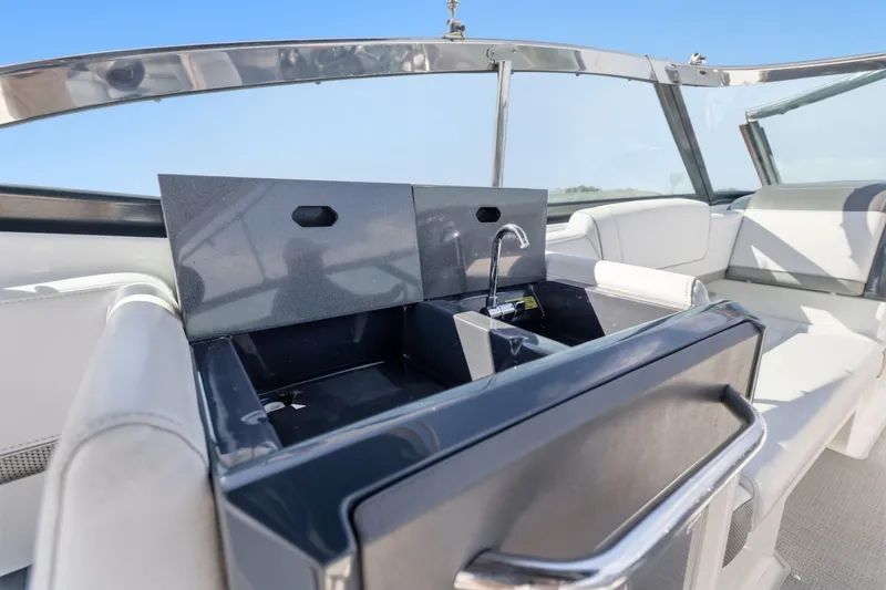 Slide: The Image of 2016 Formula 330 Crossover Bowrider interior with sleek sink and seating area. - 43