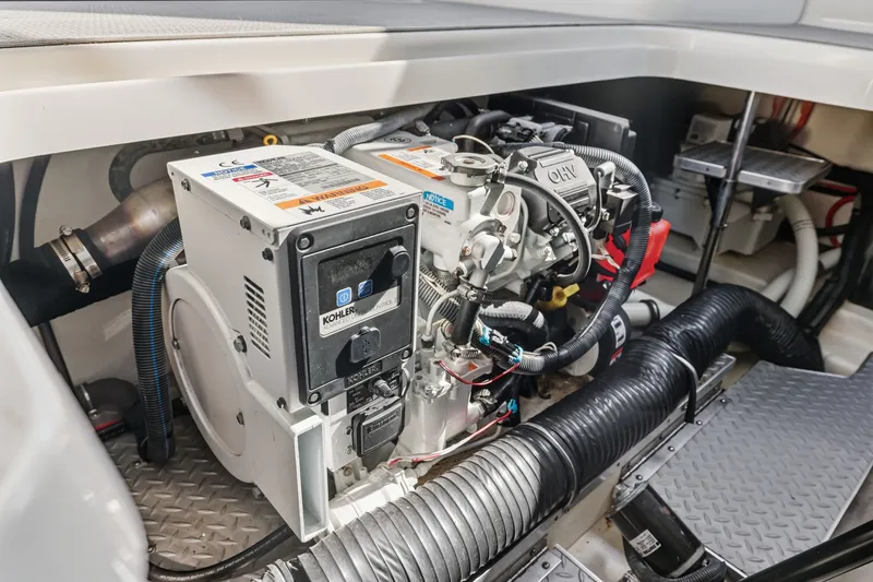 Slide: The Image of Engine compartment of a 2016 Formula 330 Crossover Bowrider, featuring Kohler generator. - 58