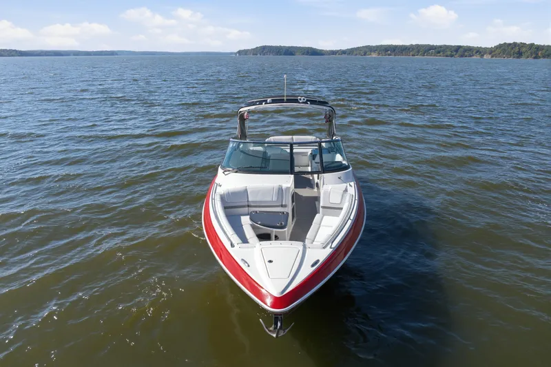 Slide: The Image of 2016 Formula 330 Crossover Bowrider on open water, showcasing sleek design and spacious seating. - 3