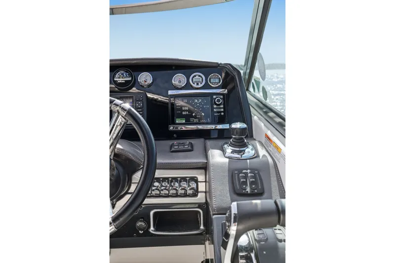 Slide: The Image of Dashboard of a 2016 Formula 330 Crossover Bowrider with navigation controls and gauges. - 37