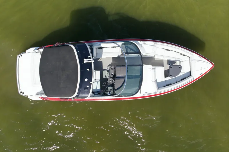 Slide: The Image of 2016 Formula 330 Crossover Bowrider, aerial view on water, showcasing sleek design. - 5