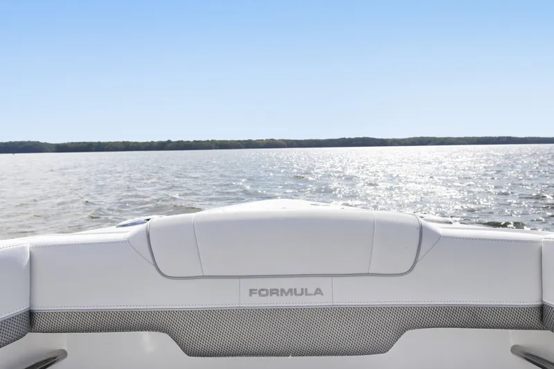 Slide: The Image of 2016 Formula 330 Crossover Bowrider on a sunny lake, showcasing sleek design. - 25