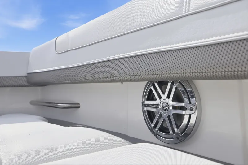 Slide: The Image of 2016 Formula 330 Crossover Bowrider interior with JL Audio speaker and cushioned seating. - 27