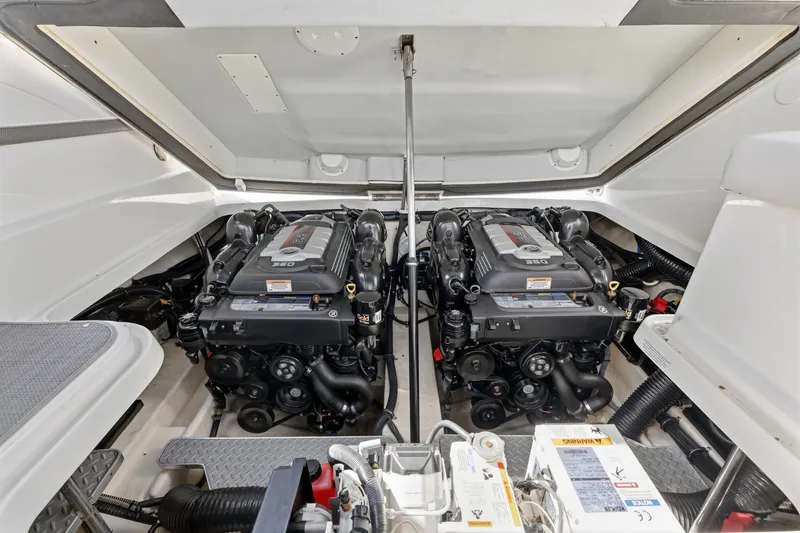 Slide: The Image of Engine compartment of a 2016 Formula 330 Crossover Bowrider with dual engines. - 54