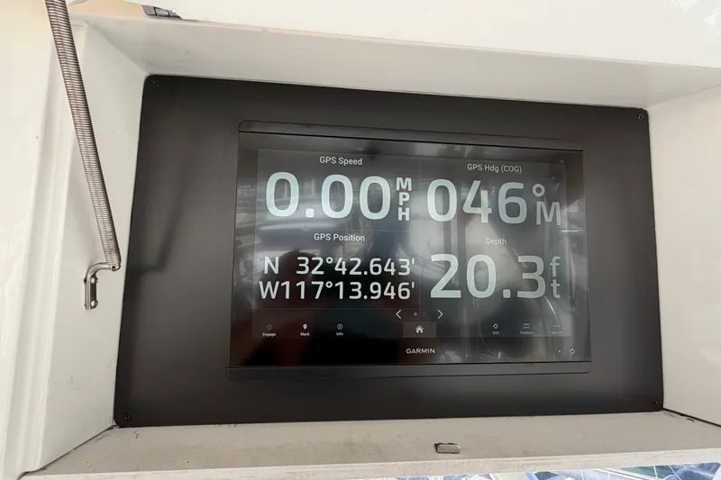 Slide: The Image of Garmin GPS display on 2000 Luhrs 40 Convertible showing speed, heading, and depth. - 34