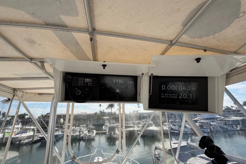 Slide: The Image of Control panel of a 2000 Luhrs 40 Convertible boat with navigation displays. - 31