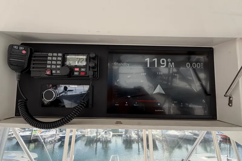 Slide: The Image of Control panel of a 2000 Luhrs 40 Convertible boat with Garmin navigation display. - 33