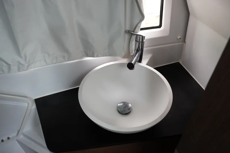 Slide: The Image of Modern bathroom sink in 2024 Jeanneau NC Sport 895 boat interior. - 37