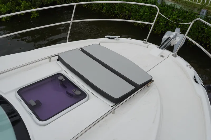 Slide: The Image of 2024 Jeanneau NC Sport 895 boat deck with cushioned seating and hatch. - 40