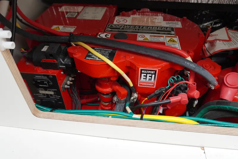Slide: The Image of Engine compartment of 2024 Jeanneau NC Sport 895 with Westerbeke generator and wiring. - 27