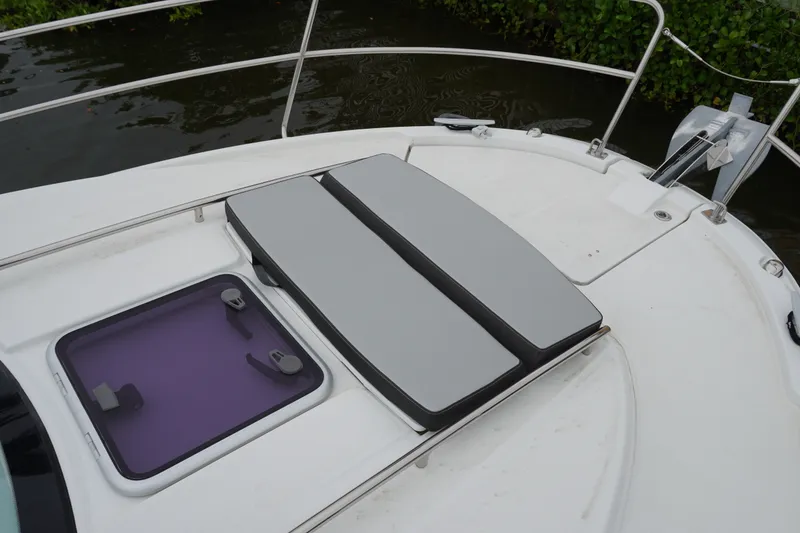 Slide: The Image of 2024 Jeanneau NC Sport 895 boat deck with cushioned seating and hatch. - 39