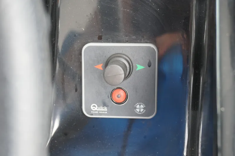Slide: The Image of Control panel of 2024 Jeanneau NC Sport 895 boat, featuring Quick THC 1042 thruster command. - 20