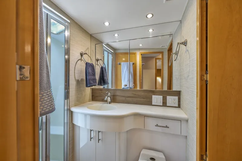 Slide: The Image of Luxurious bathroom interior of 2000 Hatteras 55 Convertible yacht with modern fixtures. - 28