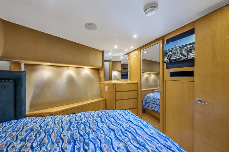 Slide: The Image of Luxurious cabin interior of 2000 Hatteras 55 Convertible yacht with modern amenities. - 27