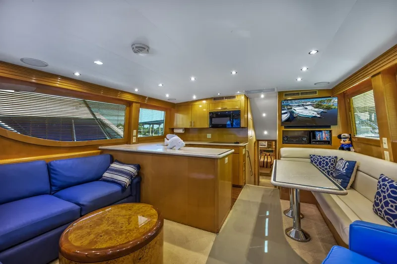 Slide: The Image of Luxurious interior of a 2000 Hatteras 55 Convertible yacht with modern amenities. - 17