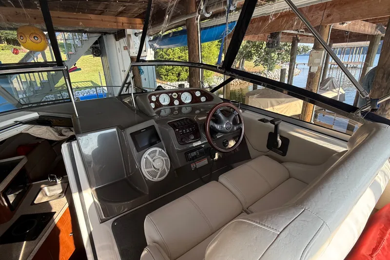 Slide: The Image of Interior of a 2007 Regal Commodore 2665 boat with steering wheel and dashboard. - 12