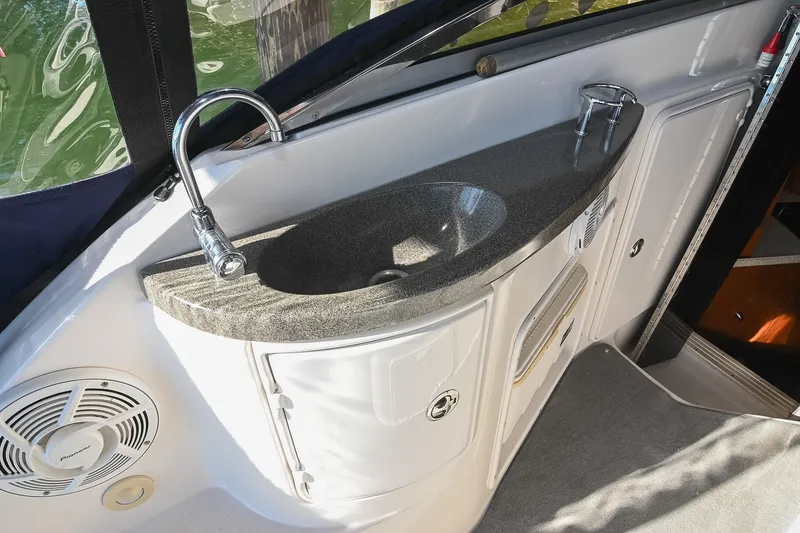 Slide: The Image of Luxury sink area on 2007 Regal Commodore 2665 boat, featuring sleek countertop and faucet. - 16