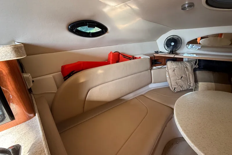 Slide: The Image of Interior of 2007 Regal Commodore 2665 boat with beige seating and table. - 20