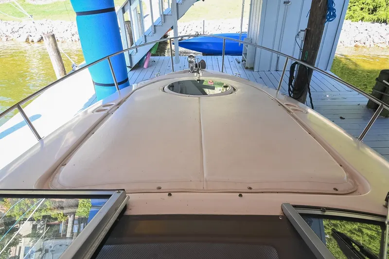 Slide: The Image of 2007 Regal Commodore 2665 boat docked, showcasing spacious deck and sleek design. - 40