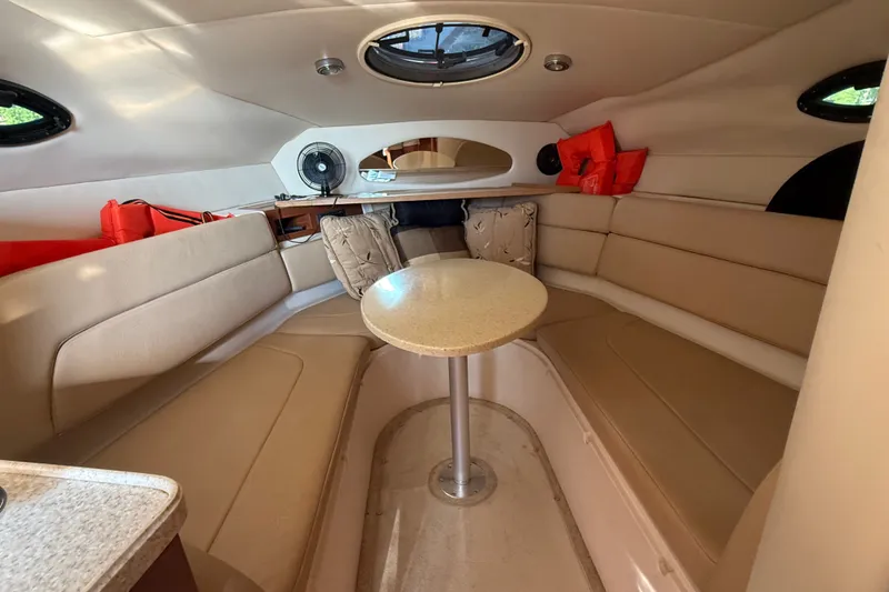 Slide: The Image of Interior of 2007 Regal Commodore 2665 boat with beige seating and table. - 21