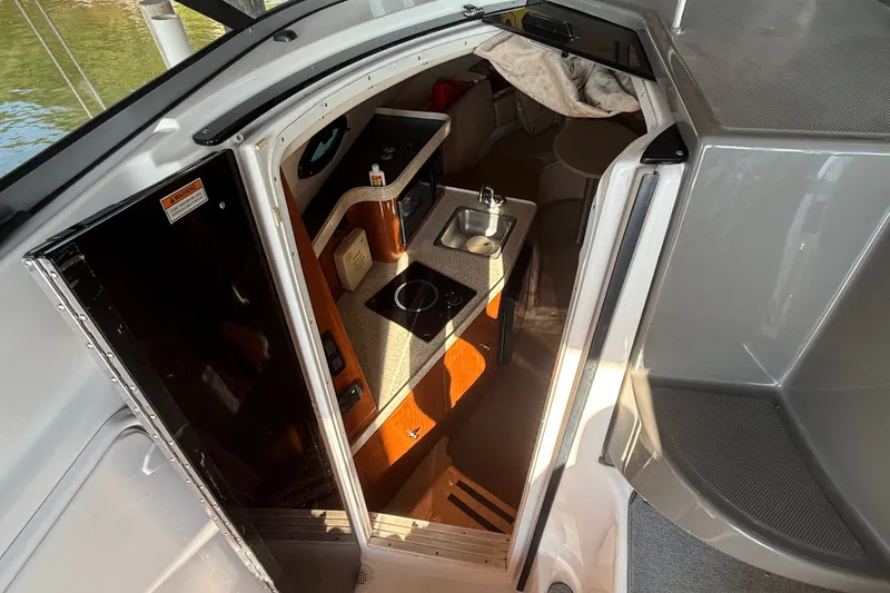 Slide: The Image of 2007 Regal Commodore 2665 cabin interior with kitchenette and seating area. - 18