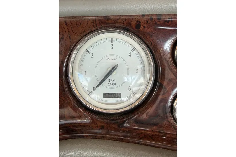 Slide: The Image of Tachometer of 2007 Regal Commodore 2665, displaying RPM in a wooden dashboard. - 29