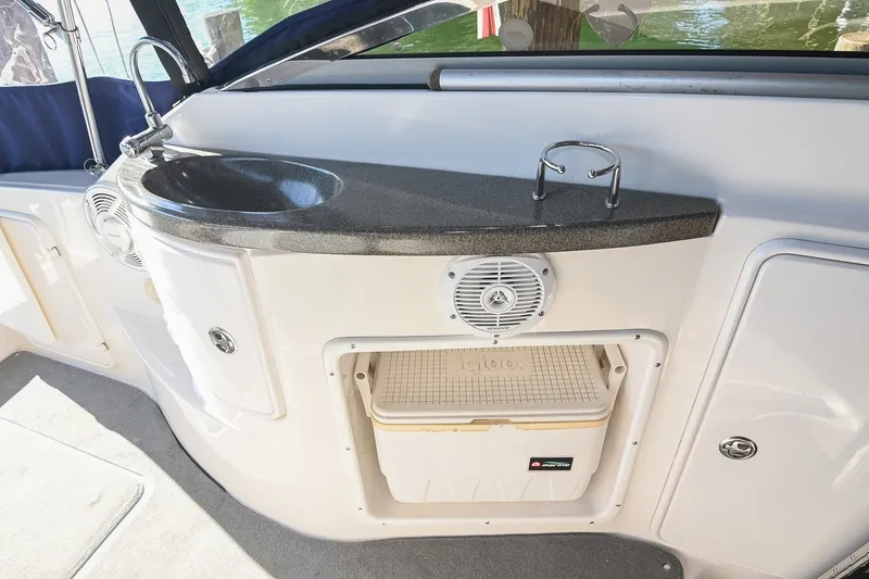 Slide: The Image of 2007 Regal Commodore 2665 boat interior with sink, speaker, and storage compartment. - 15