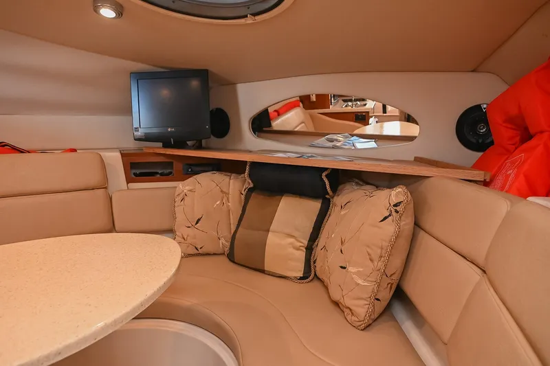 Slide: The Image of Luxurious interior of 2007 Regal Commodore 2665 yacht with cozy seating and entertainment system. - 33