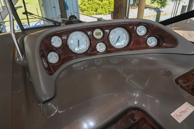 Slide: The Image of Dashboard of a 2007 Regal Commodore 2665 boat with gauges and controls. - 20
