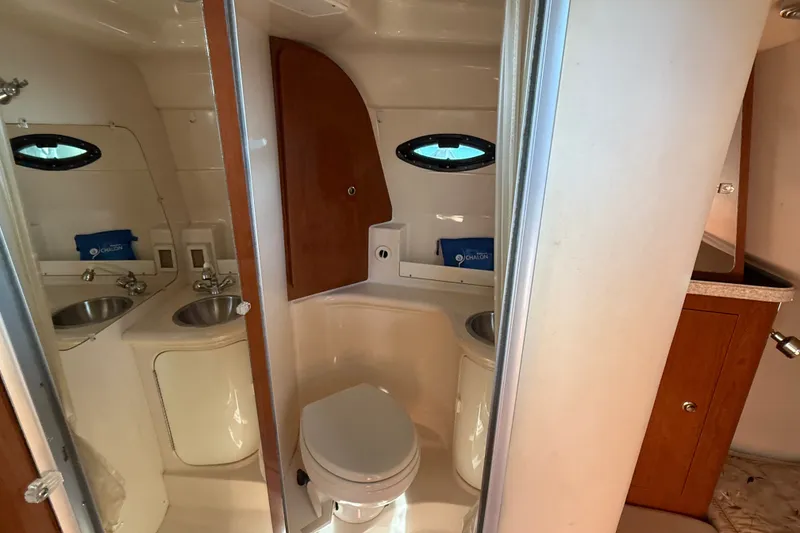 Slide: The Image of Bathroom interior of 2007 Regal Commodore 2665 boat with sink and toilet. - 27