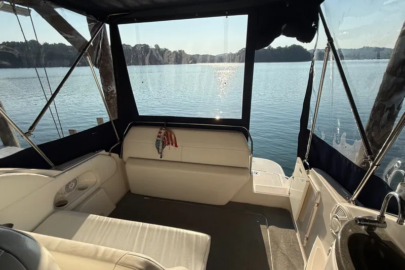 Slide: The Image of Interior of 2007 Regal Commodore 2665 boat with lake view through windows. - 16