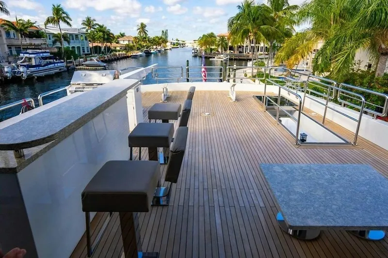 Slide: The Image of Luxurious deck of 2020 Ocean Alexander 100 Skylounge Megayacht with bar and seating. - 33