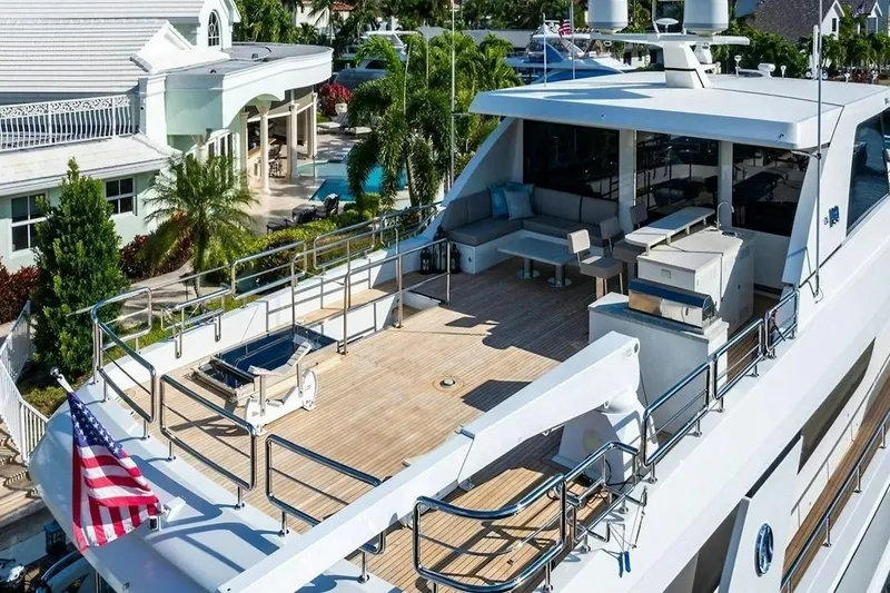 Slide: The Image of Luxurious 2020 Ocean Alexander 100 Skylounge Megayacht with spacious deck and elegant seating area. - 32