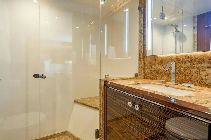 Slide: The Image of Luxurious bathroom in 2020 Ocean Alexander 100 Skylounge Megayacht with marble accents and modern fixtures. - 21
