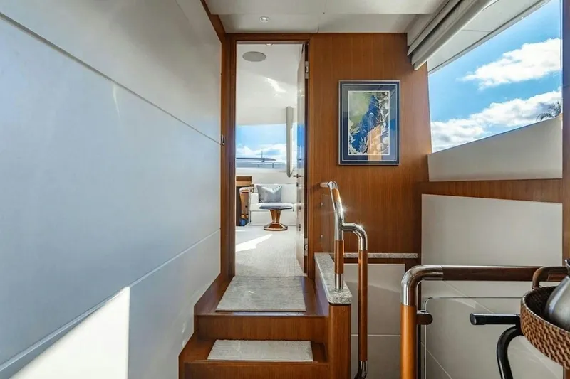 Slide: The Image of Interior view of 2020 Ocean Alexander 100 Skylounge Megayacht, featuring elegant wood paneling. - 7