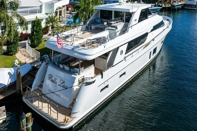 Slide: The Image of 2020 Ocean Alexander 100 Skylounge Megayacht docked in a serene marina setting. - 42
