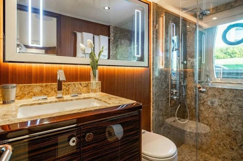 Slide: The Image of Luxurious bathroom in 2020 Ocean Alexander 100 Skylounge Megayacht with elegant marble and wood finishes. - 17