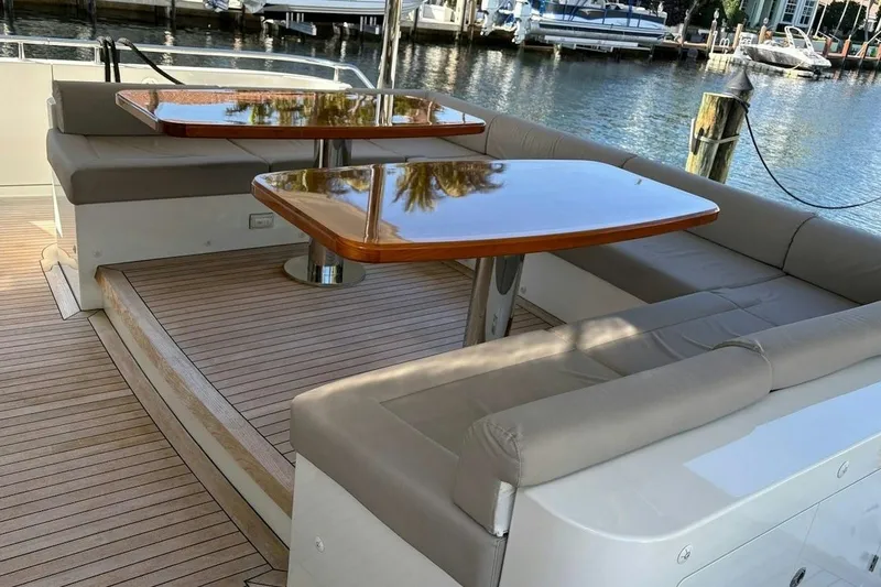 Slide: The Image of Luxurious seating area on 2020 Ocean Alexander 100 Skylounge Megayacht, docked by the water. - 31