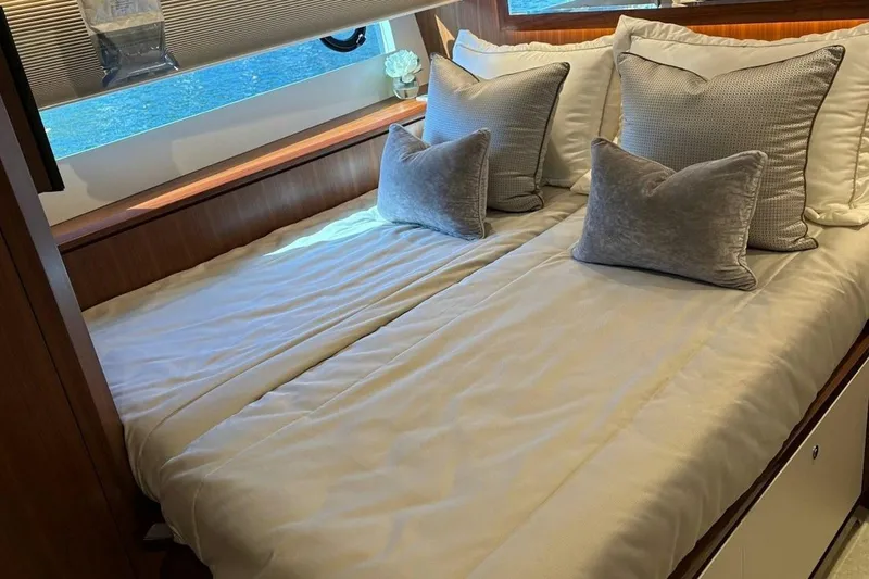 Slide: The Image of Luxurious bedroom interior of 2020 Ocean Alexander 100 Skylounge Megayacht with elegant bedding. - 22