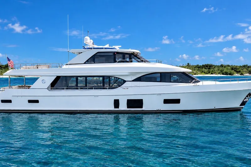 The Image of 2020 Ocean Alexander 100 Skylounge Megayacht on clear blue water, side view. - 0