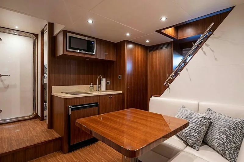 Slide: The Image of Luxurious interior of 2020 Ocean Alexander 100 Skylounge Megayacht with modern kitchenette and seating area. - 26