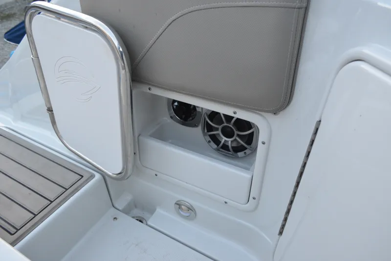 Slide: The Image of 2024 Crownline 270 CR boat interior with speaker and storage compartment. - 31
