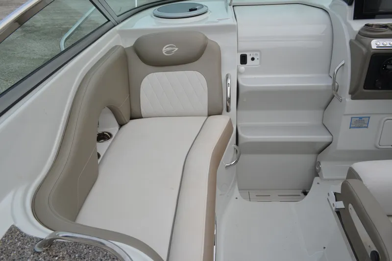 Slide: The Image of 2024 Crownline 270 CR boat interior with beige and white seating. - 9