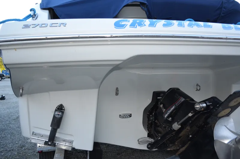 Slide: The Image of 2024 Crownline 270 CR boat stern with MerCruiser engine and Lenco trim tabs. - 6