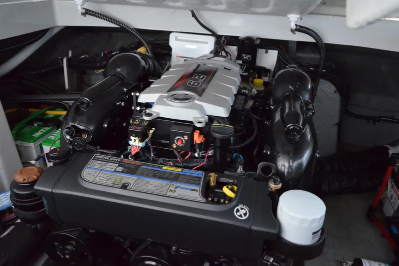Slide: The Image of 2024 Crownline 270 CR engine compartment showcasing powerful Mercury engine. - 32