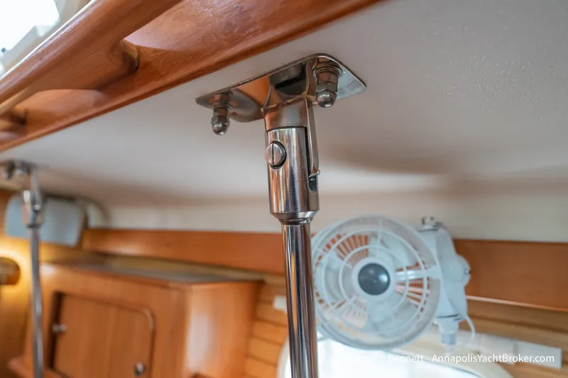 Slide: The Image of Interior of 2003 Catalina 380 yacht showing metal support pole and fan. - 52